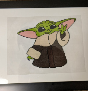 A photo of the Baby Yoda cross-stitch.