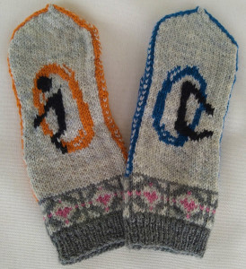 Two gray mittens outlined in orange and blue. One has an orange portal with a black human shape emerging from it, and the other has a blue portal with the same human shape stepping inside. The bottoms of the mittens are ringed by gray and pink companion cubes.