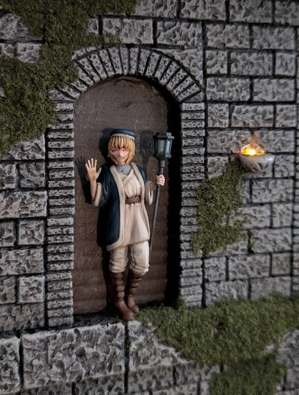 A close-up of Falin, standing in an arch above the scene. She is holding her staff, waving, and smiling warmly.