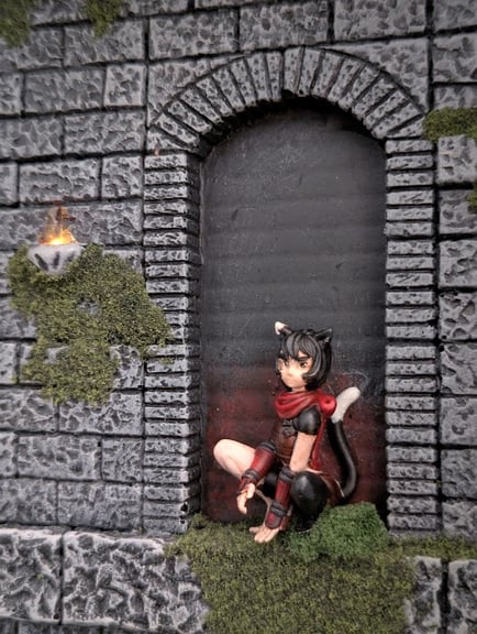 A close-up of Izutsumi, crouching in an arch above the scene. She is sitting on all fours, scowling at the scene below.