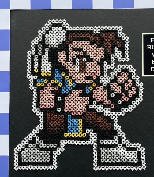 Close up of Chun-Li. Shown with a scale marked in inches.