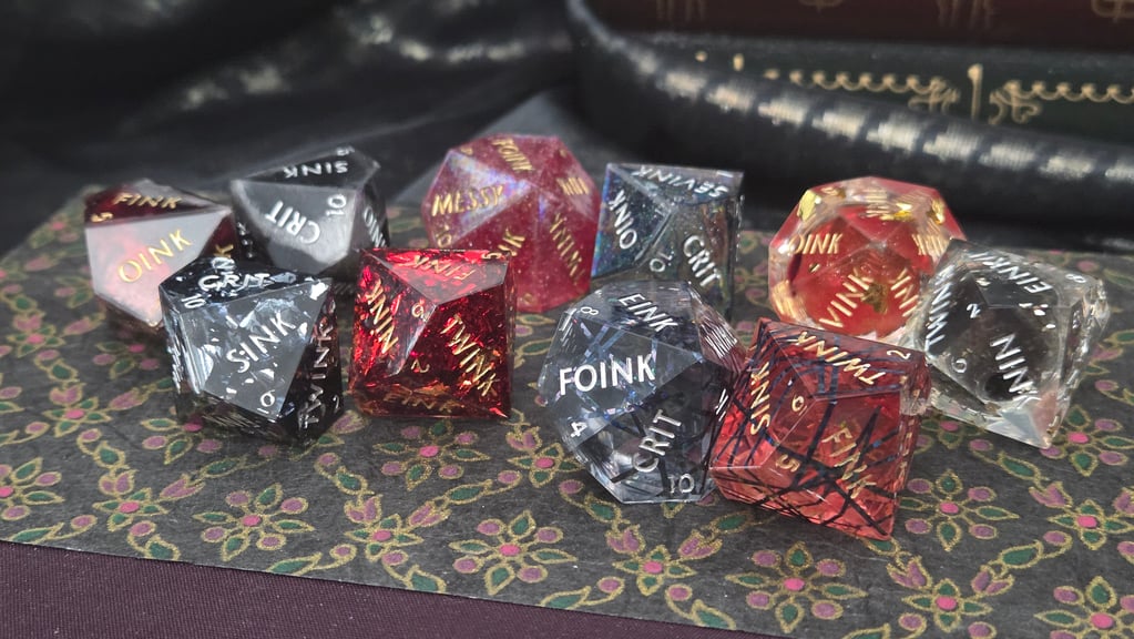 The full set of five black normal dice and five red hunger dice.  This set contains five pair of dice in different styles including mica powder, foils, liquid cores, holo foil, and dice criscrossed with black lines meant to evoke a diablarist's aura.