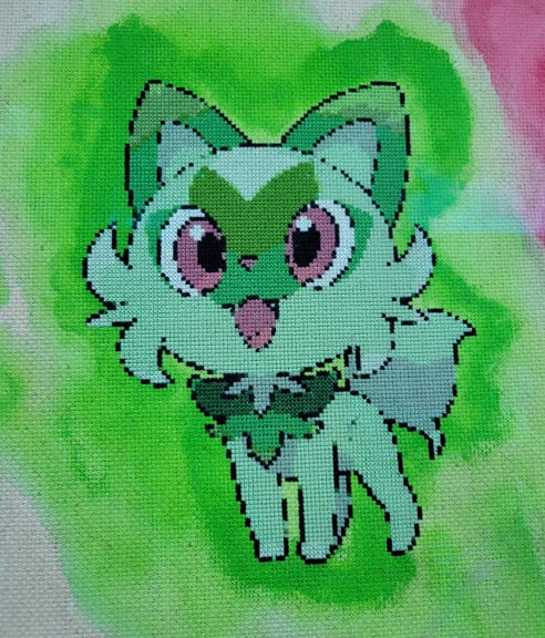 A close-up of Sprigatito 