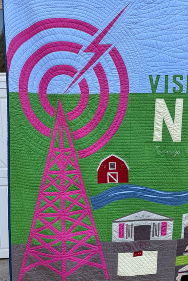 A closeup on the radio tower section of the quilt