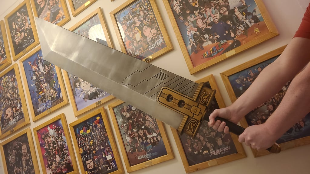 A shot from below of the sword being held against a backdrop of framed posters.