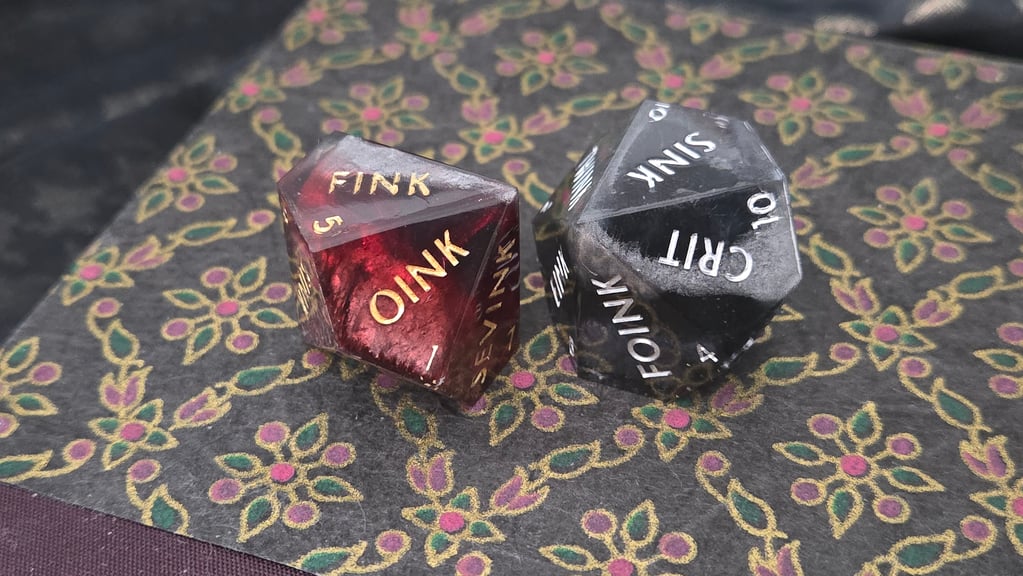 Two d10 dice with mica powder layers imitating stone.