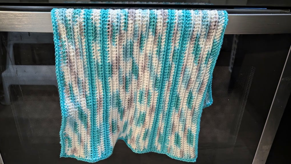 Tea Towel hanging from an oven