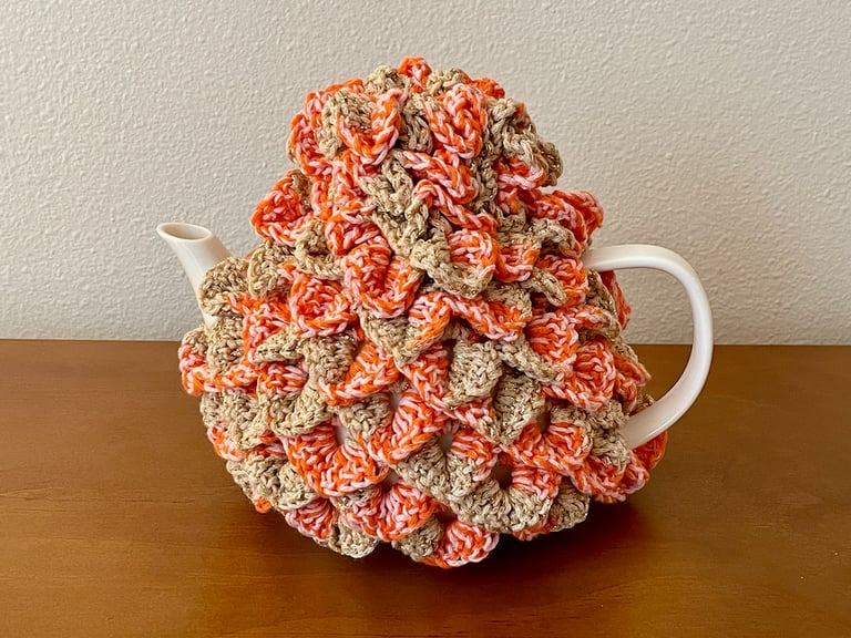 Dawn Guard themed teapot cozy, crocheted from a cotton blend yarn with metallic strand. Measures 7" tall x 7" wide" x 7" deep
