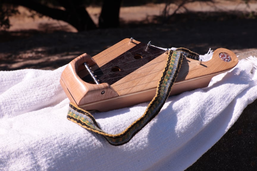 Instrument and strap together