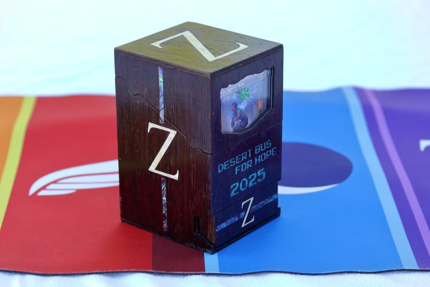 The Zeta Shift box standing alone. There are bluish-purple stripes highlighting the Z logo on the sides and drawer,