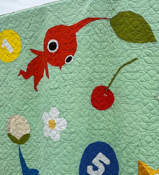 A close up of the area with the red Pikmin and the cherry.