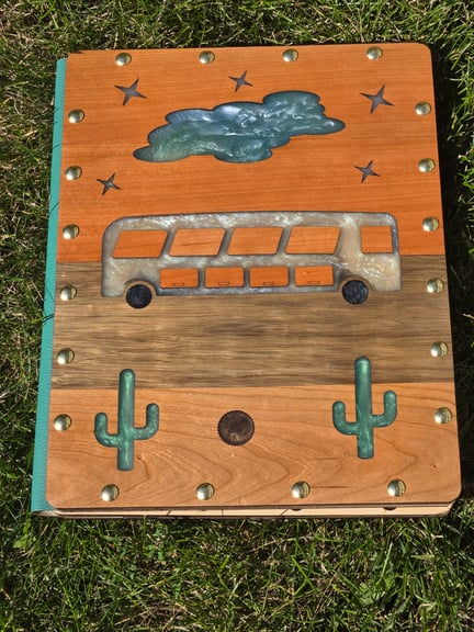 The Desert Bus rolls along 4 parallel boards
2 board cherry wood sky with glow-in-the-dark stars and cloud
Limba wood road
Ash wood desert with cacti and tumbleweed