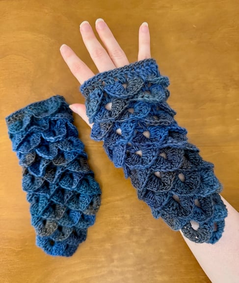 Night watch themed Fingerless gloves, crocheted with a wool/acrylic blend yarn. Closest fit is likely a men's small or a women's medium.