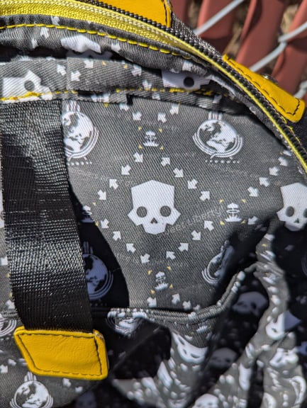 A close up of the interior fabric, showing the Helldivers skull, repeating Hellbomb code, and quotes from the game arranged in a custom design.