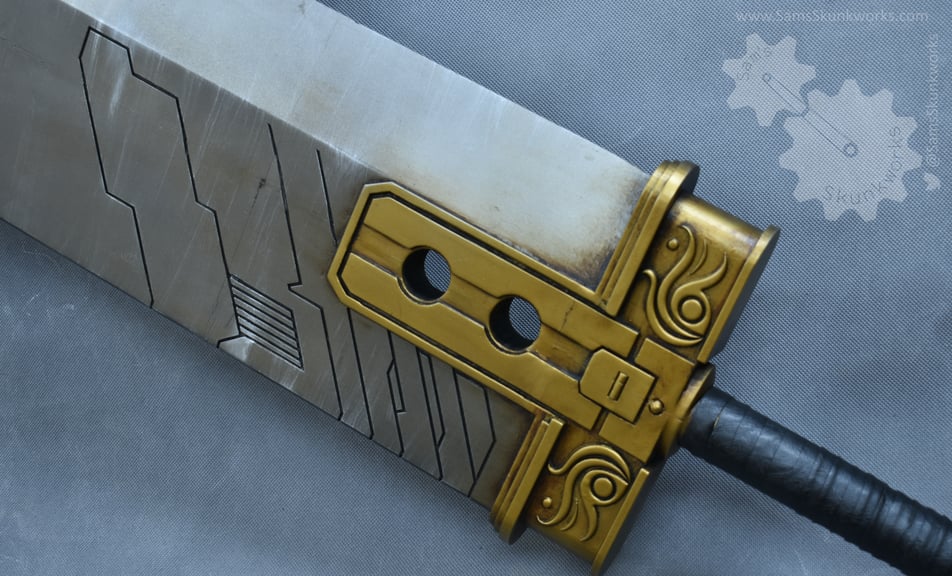 A close-up of the opposite side of the sword hilt, showing the golden detailing and circuit patterns.