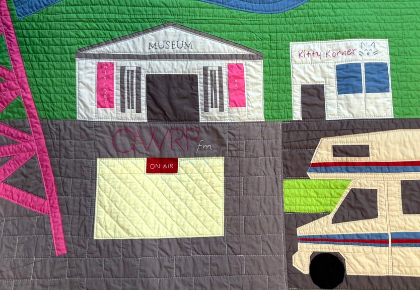 A closeup showing the Nsburg Museum, QWRP building, Kitty Korner, and the RV