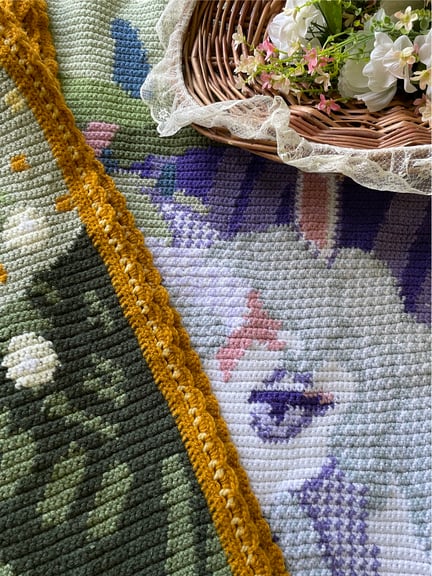 I wanted to show off the stitches and get a closer look at the border here. The Unicorn is peeking out from behind the frame-like border and the detailing of the flora that surround her are on full display here.