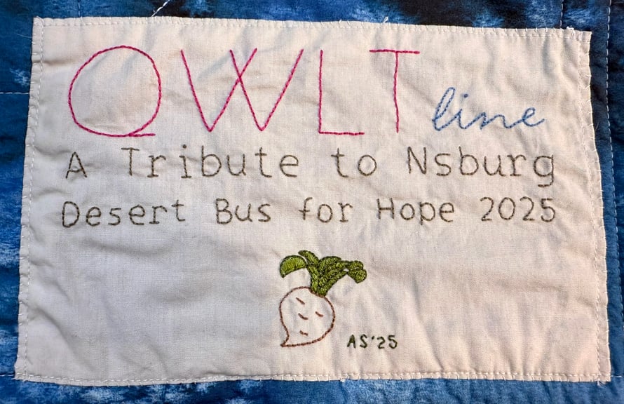 This hand-embroidered label is on the back of the quilt