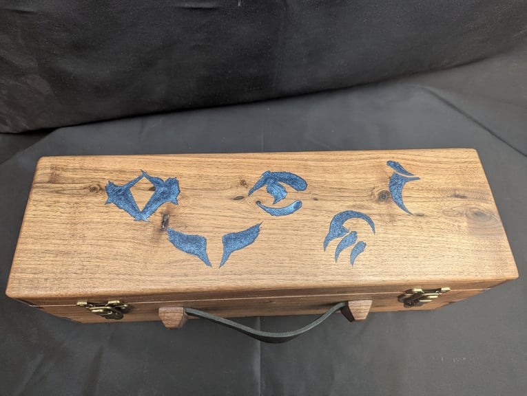 The 5 symbols of the Tarkir clans, engraved into the top and then inlayed with coloured epoxy.