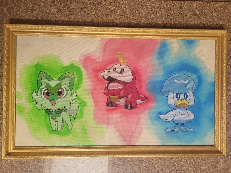 A full view of the painting, with gold frame and all 3 Paldean starters