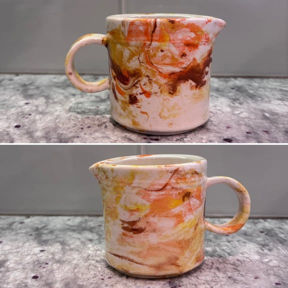 Two views of the creamer, highlighting the color marbling.