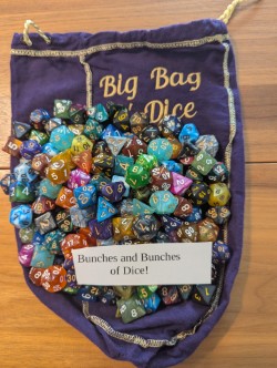 You've seen the quality, now for the quantity. We have bunches and bunches of dice in a rainbow of colors. All the dice you could need for your RPG needs. Unless you play Exalted, then bring a few more d10s. I never get tired of that joke. 

Last but not least is the bag itself. It's an embroidered crown royale bag as large as I could find. We all know that Crown Royale sells dice bags and throws in a bottle for good measure. I just took it to the next level. 

There are a few other nice surprises in store for you. Get the bag and find out!